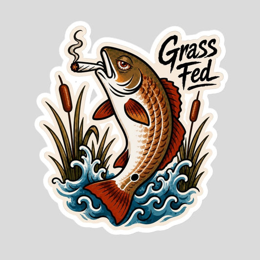 Tidewater Rods Grass Fed redfish vinyl sticker featuring a fish smoking in marsh grass, durable outdoor design.